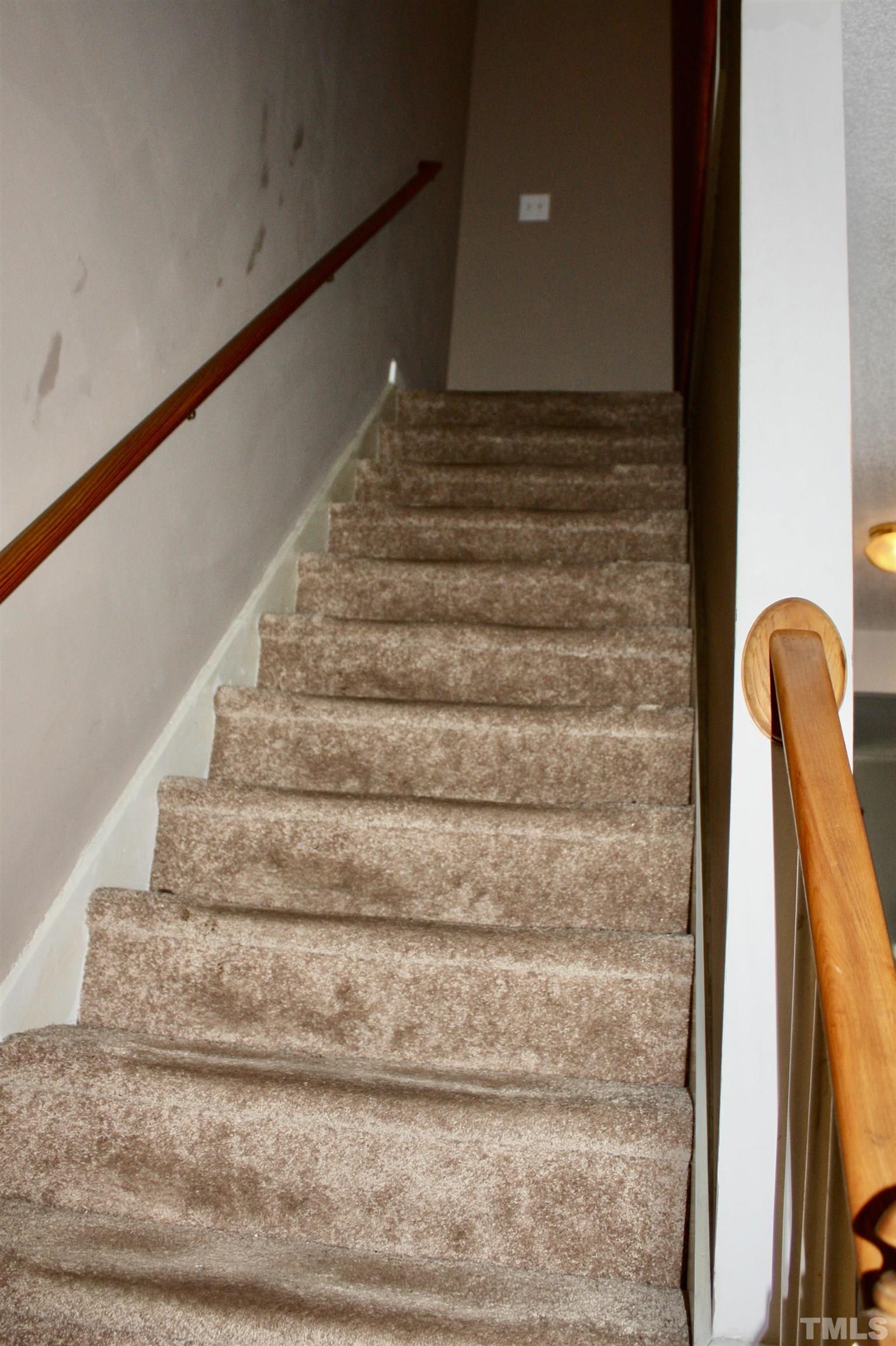 4702 Tanglewood Oaks Street Raleigh, NC 27610 - Photo 5 of 11 a view of staircase with white walls