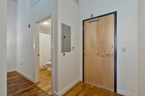 a view of bathroom with a sink and shower