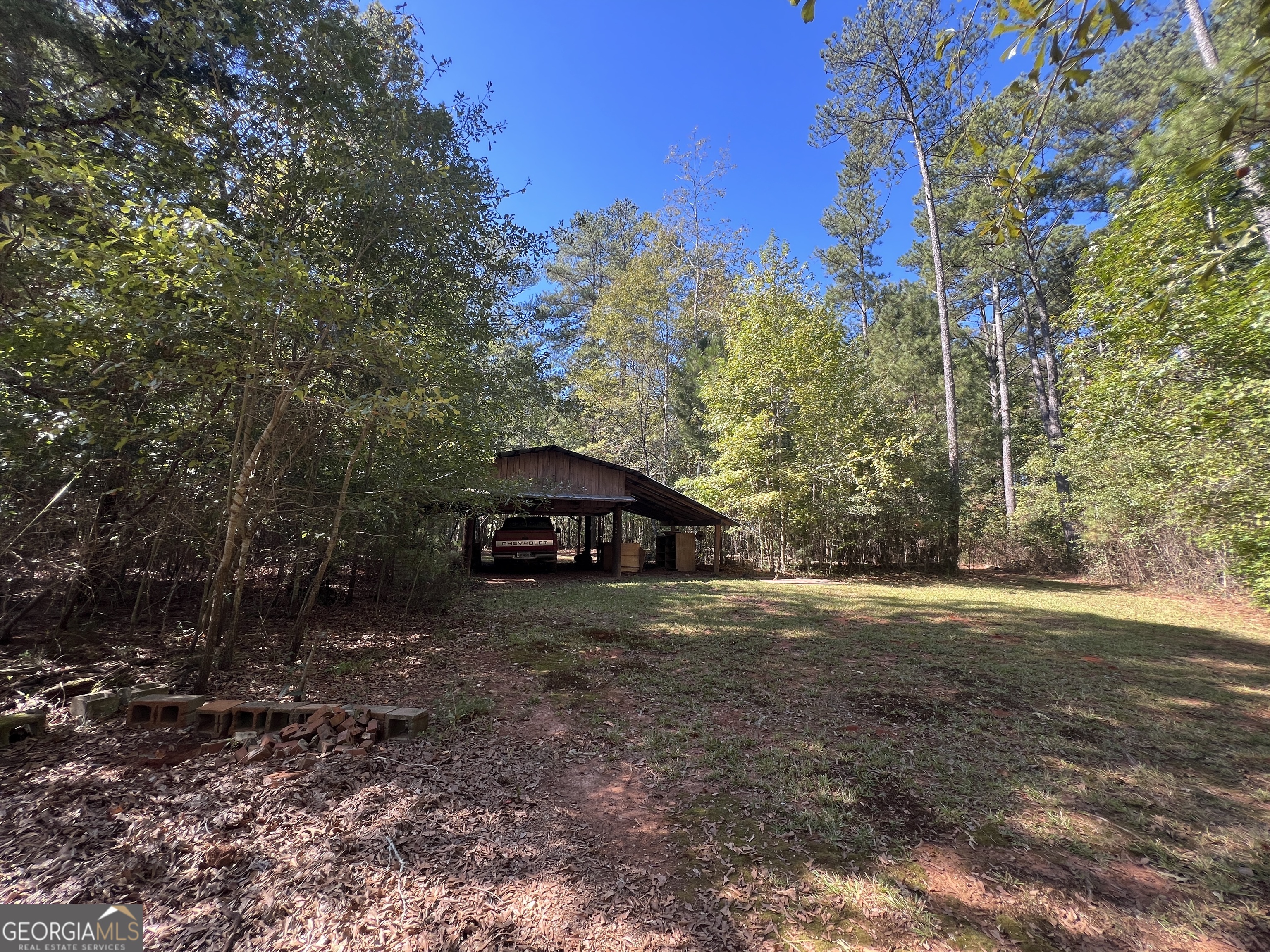 1500 Pine Forest Road Mansfield, GA 30055 - Photo 18 of 47 a view of a wooden floor with a yard