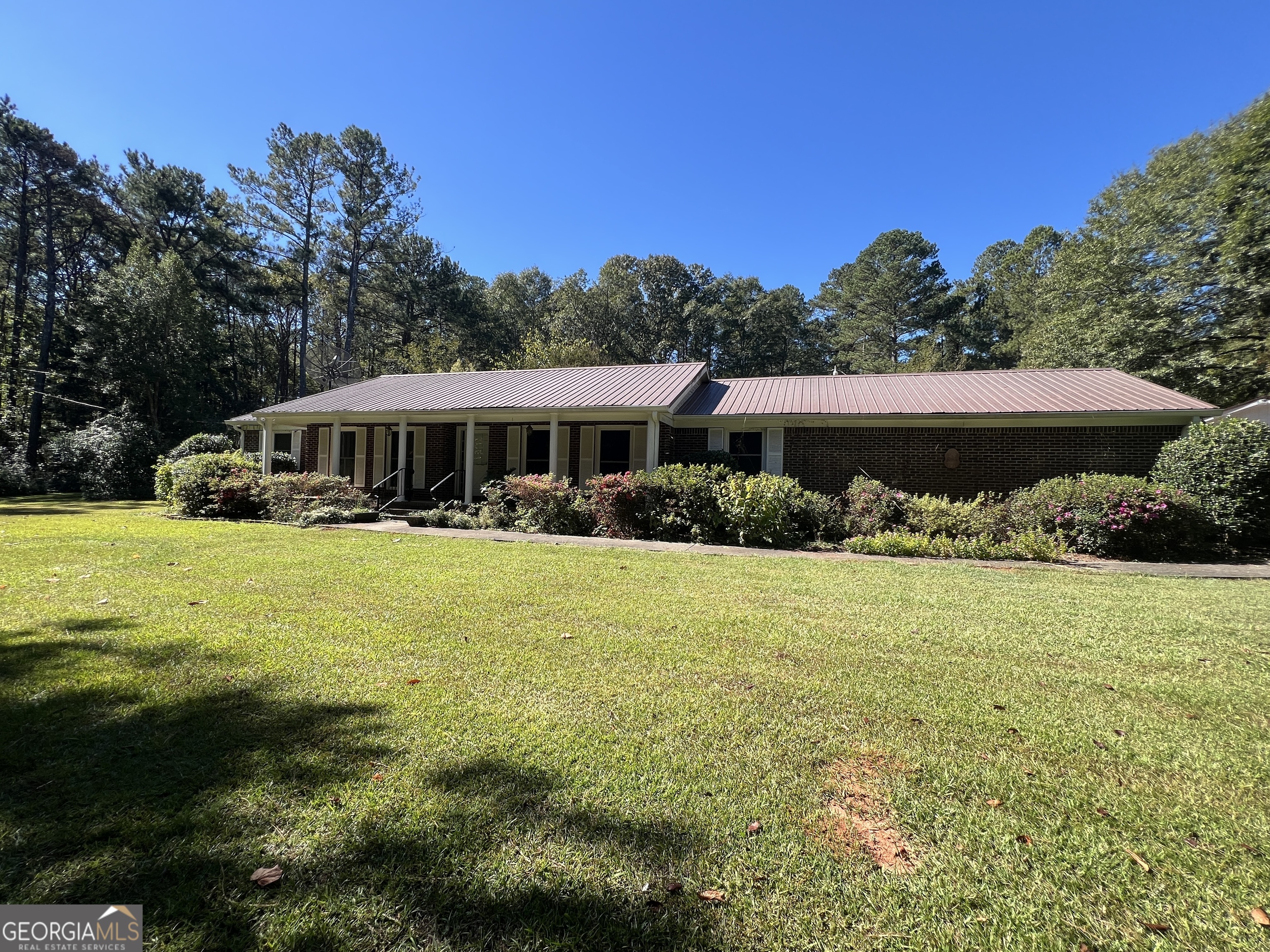 1500 Pine Forest Road Mansfield, GA 30055 - Photo 3 of 47 a view of a house with swimming pool and yard