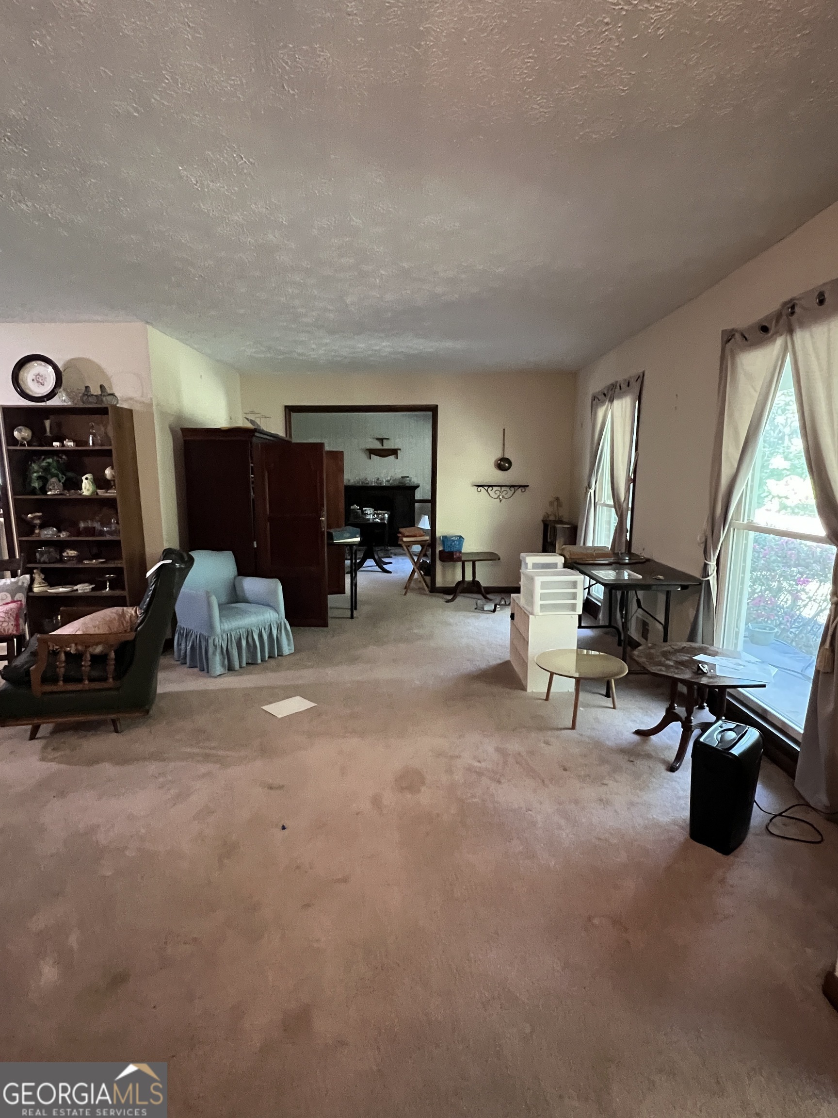1500 Pine Forest Road Mansfield, GA 30055 - Photo 35 of 47 a living room with furniture and a large window