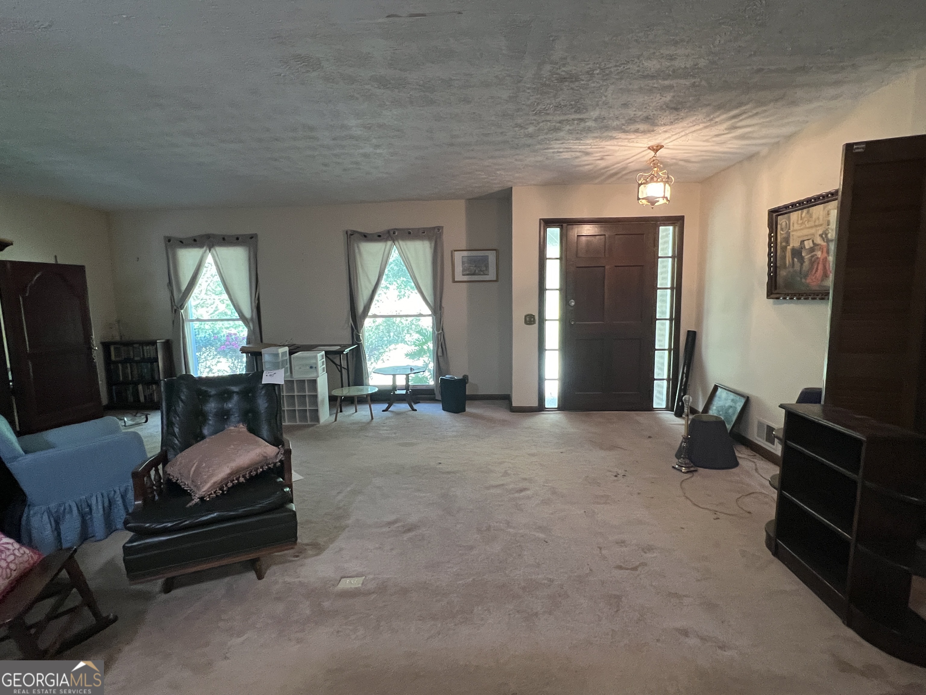 1500 Pine Forest Road Mansfield, GA 30055 - Photo 36 of 47 a room with furniture and a flat screen tv