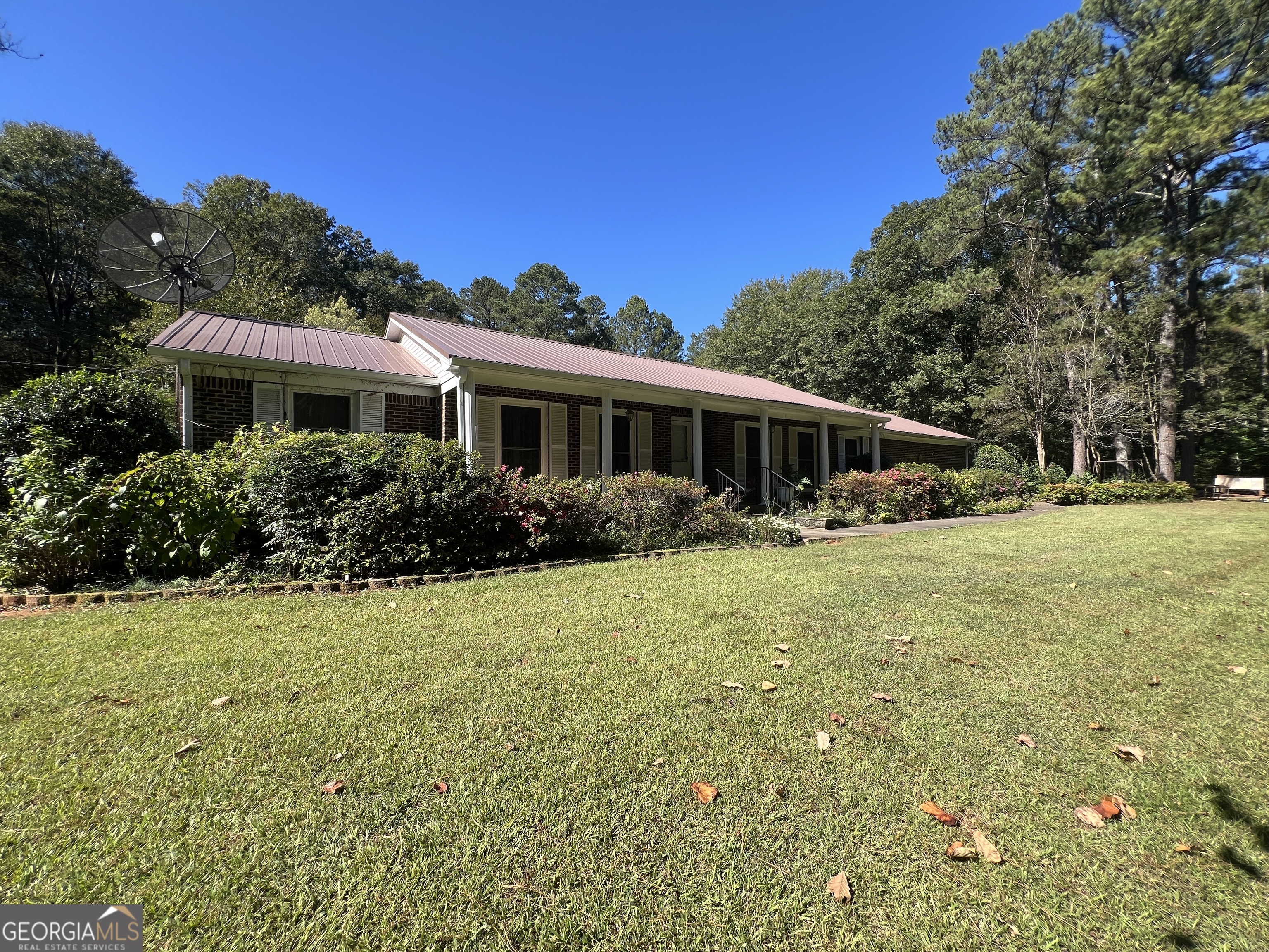 1500 Pine Forest Road Mansfield, GA 30055 - Photo 5 of 47 a view of a house with backyard and garden