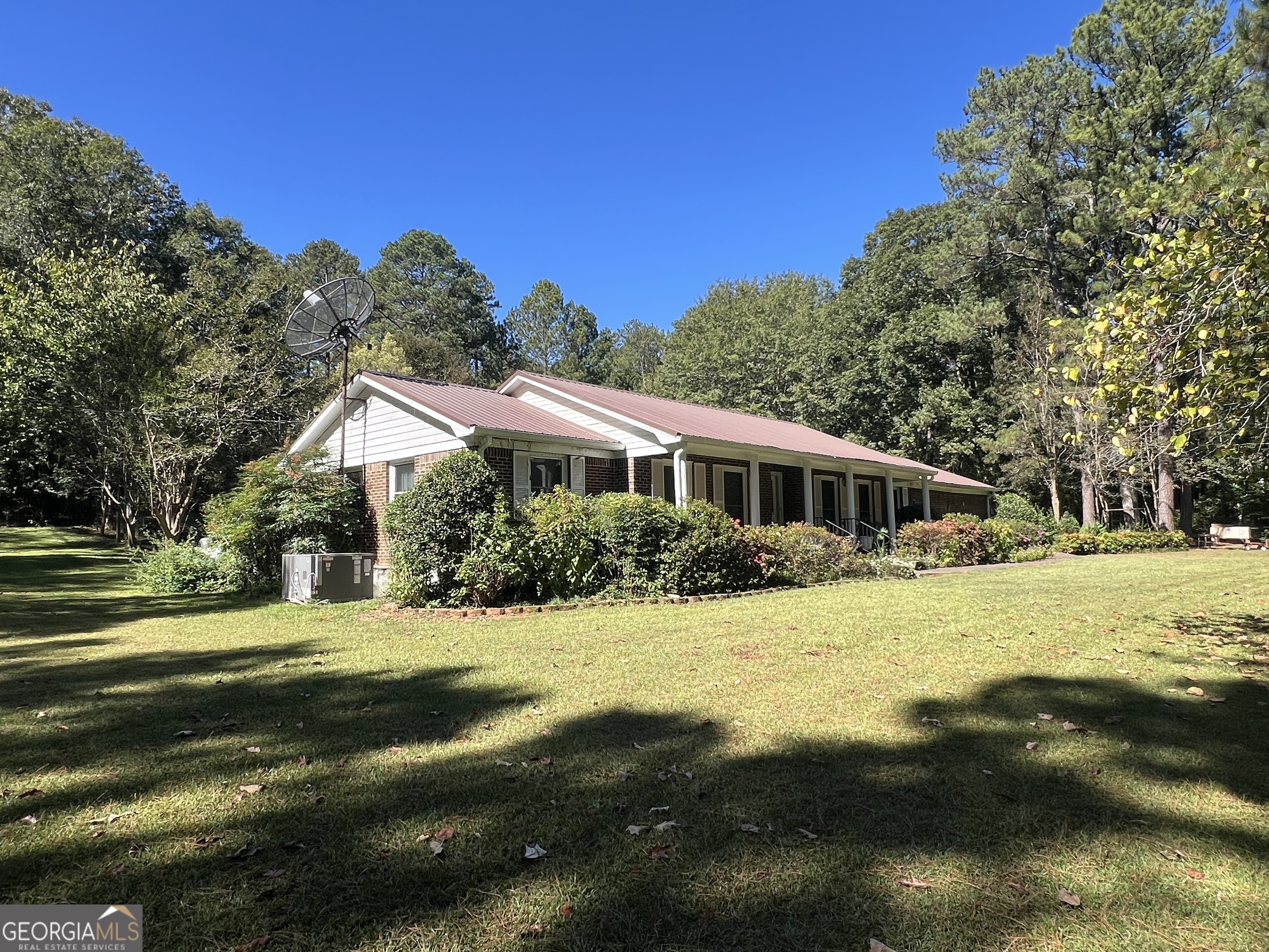 1500 Pine Forest Road Mansfield, GA 30055 - Photo 7 of 47 a front view of a house with a yard