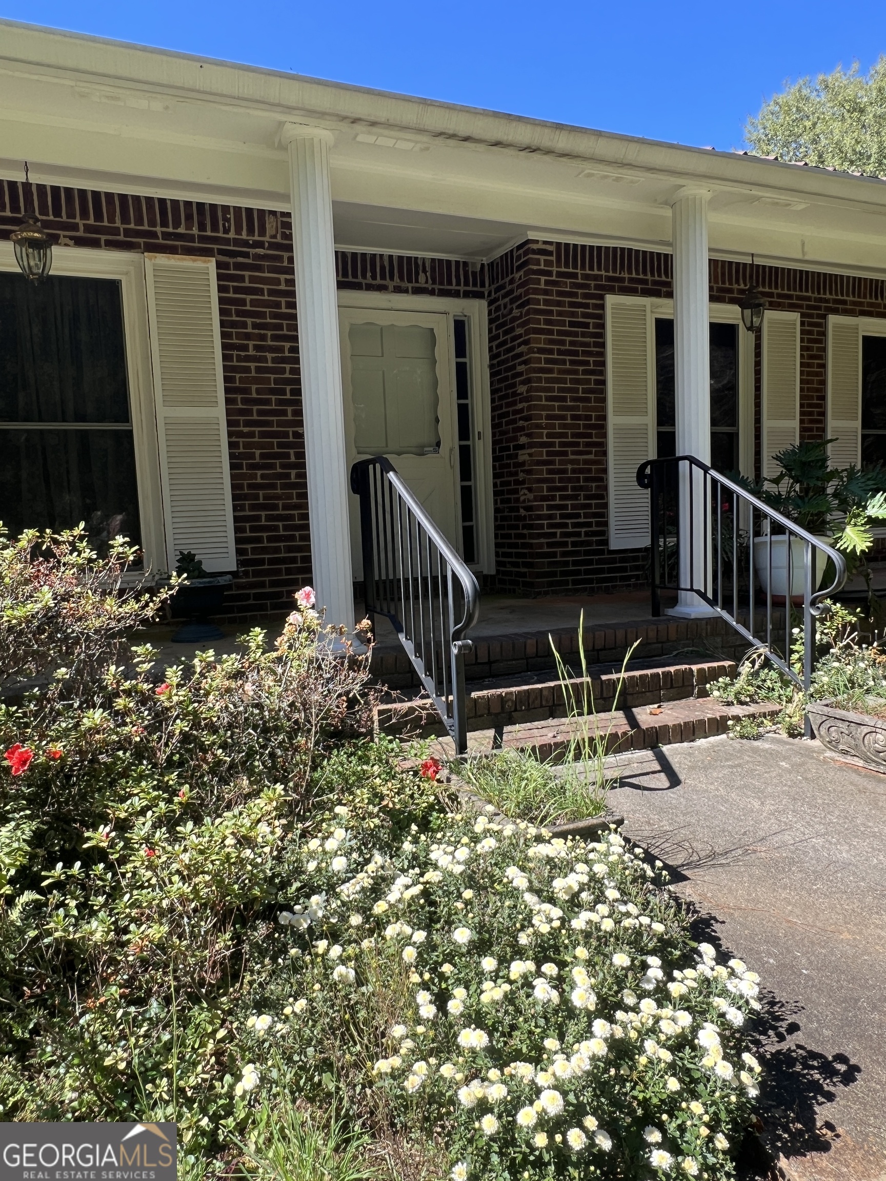 1500 Pine Forest Road Mansfield, GA 30055 - Photo 10 of 47 a view of two chairs in the backyard of the house