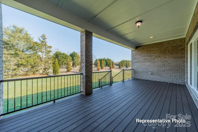 a view of a balcony with wooden floor