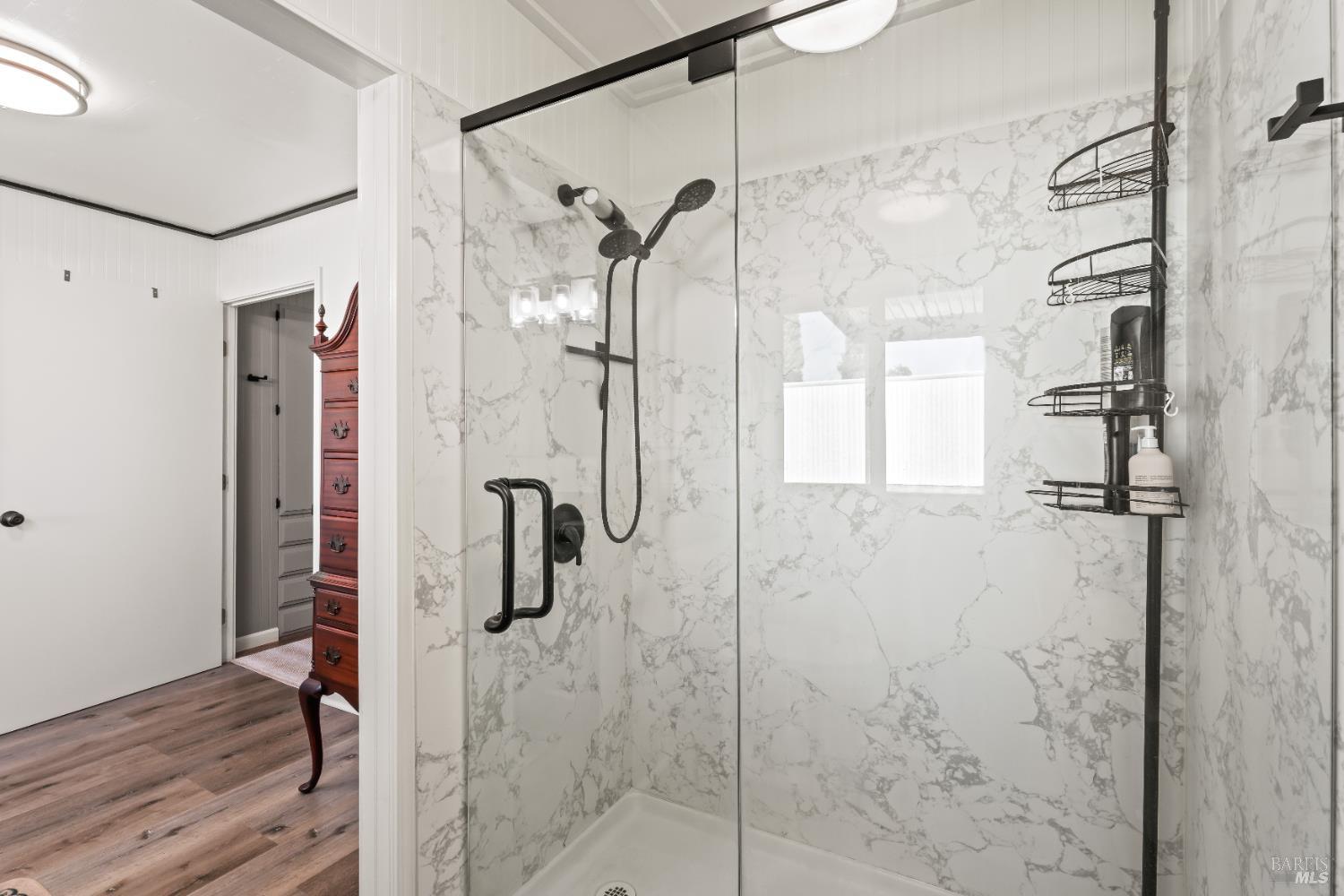 660 Leslie Street, Unit 11 Ukiah, CA 95482 - Photo 18 of 24 Remodeled walk in shower in the primary bath.