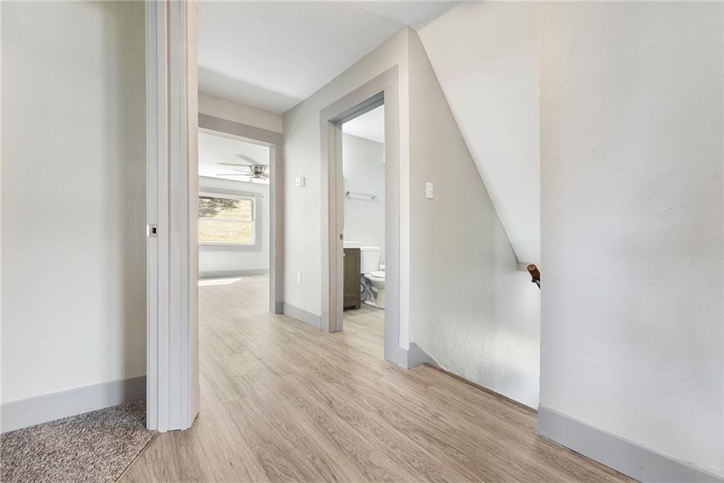 808 Mill Street Bridgeville, PA 15017 - Photo 16 of 27 a view of a hallway with wooden floor and entryway