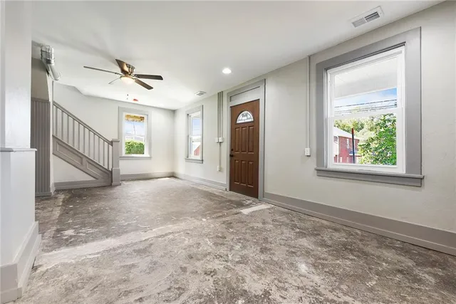 a view of an empty room with a window