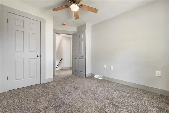 an empty room with fan