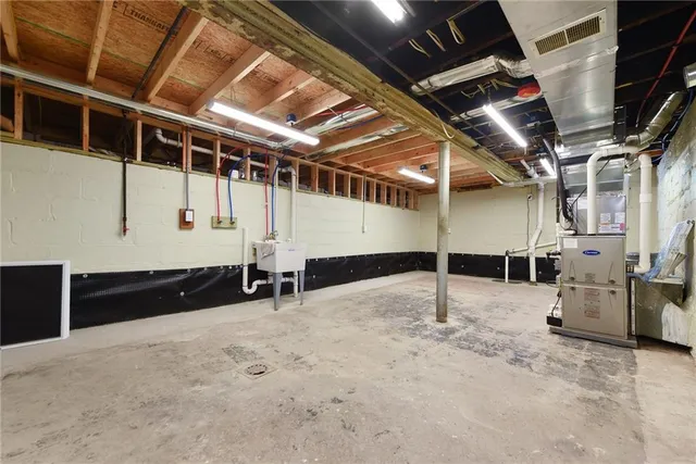 a view of empty room with wooden walls