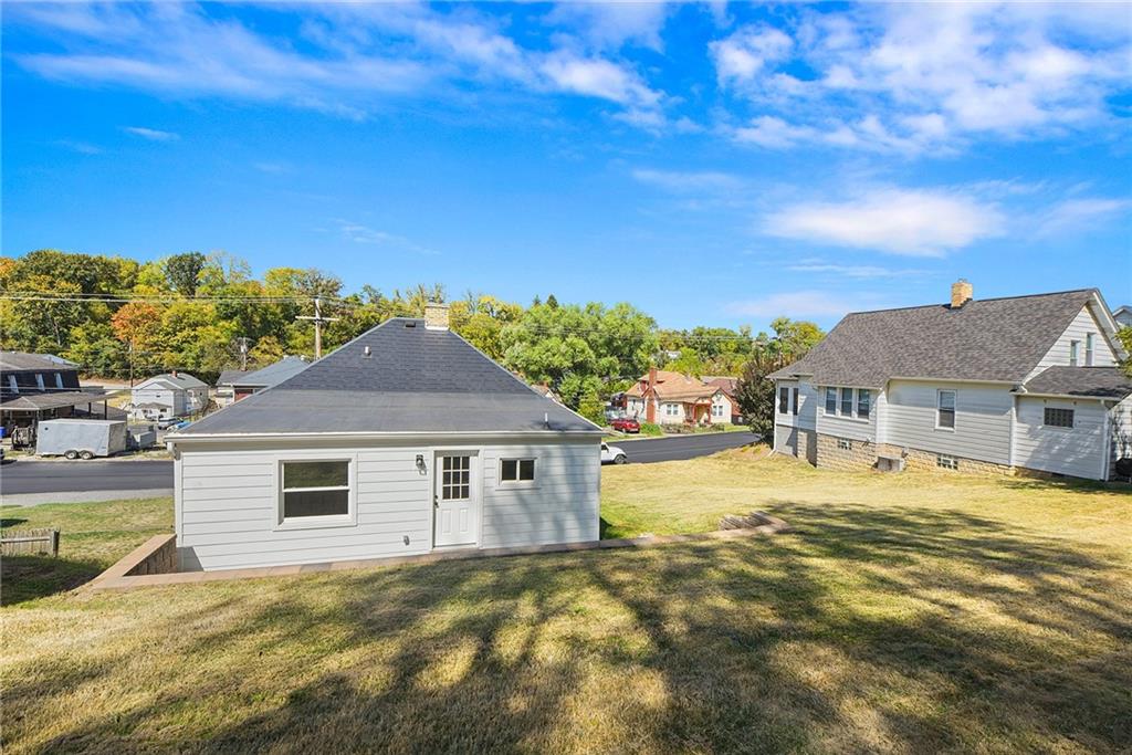 808 Mill Street Bridgeville, PA 15017 - Photo 3 of 27 a front view of house with yard and trees in the background
