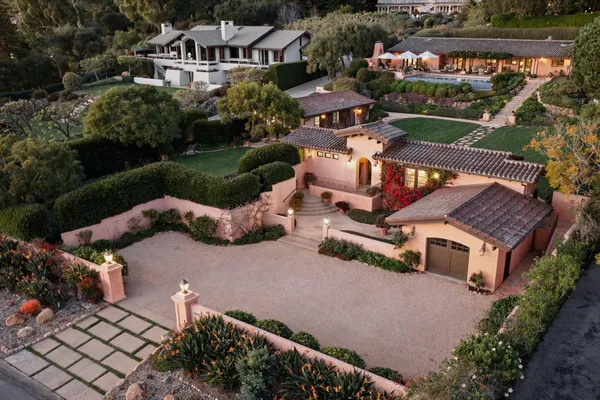 an aerial view of a house with a garden