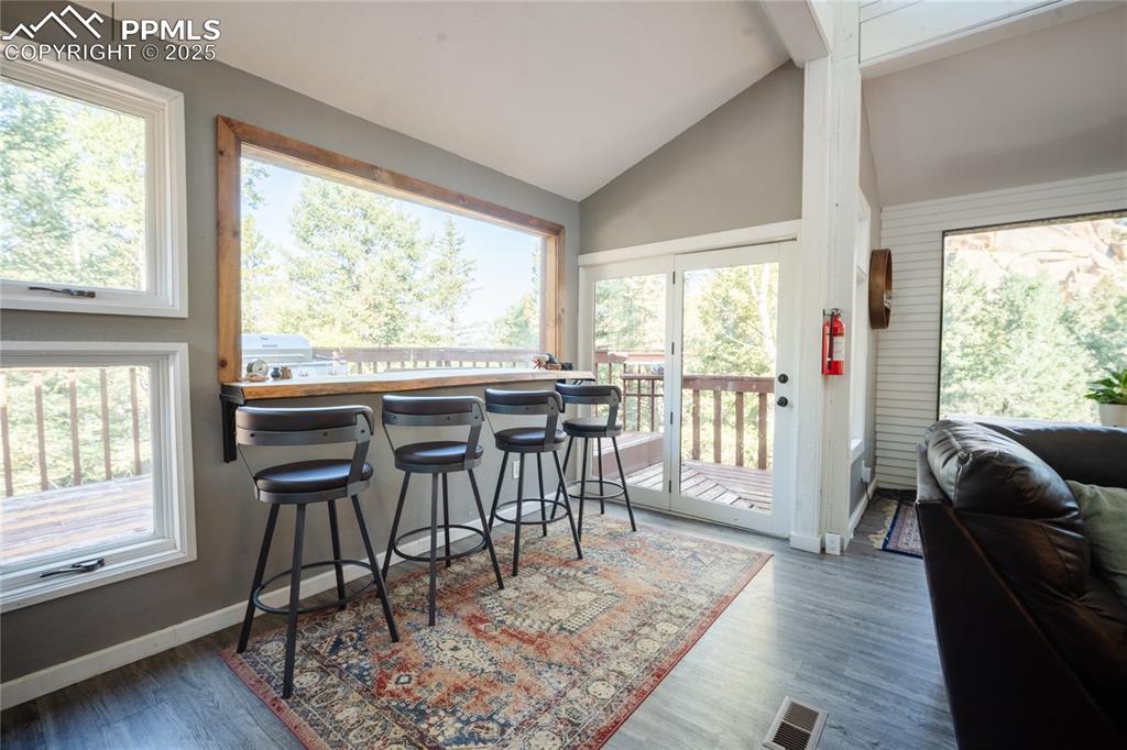 57 Granite Road Florissant, CO 80816 - Photo 12 of 46 a view of a dining room with furniture window and wooden floor