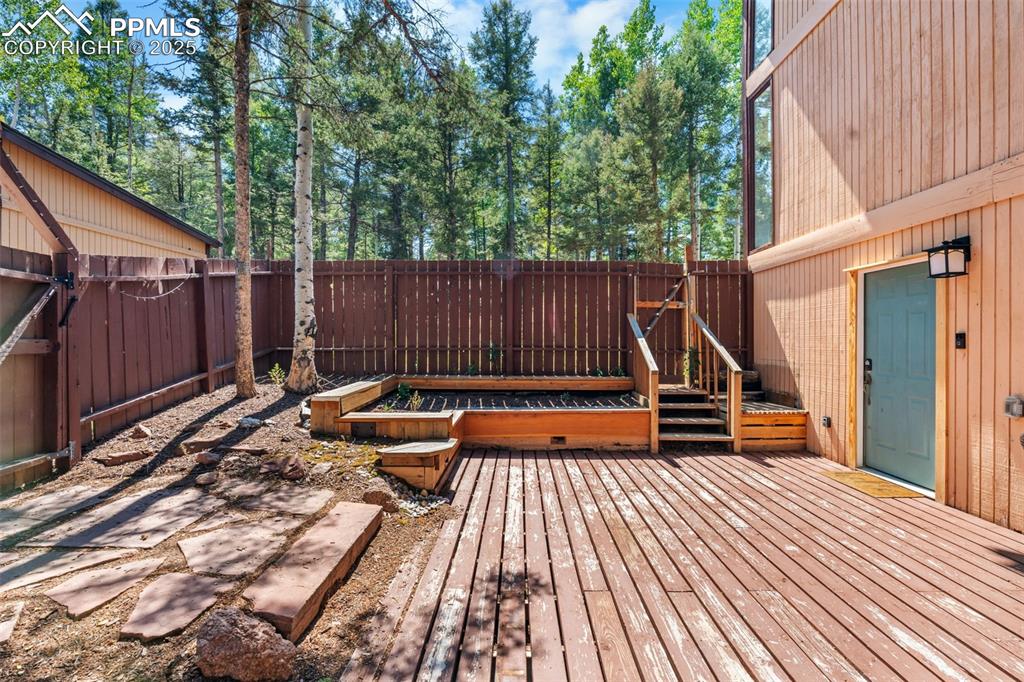 57 Granite Road Florissant, CO 80816 - Photo 39 of 46 a view of a wooden deck with a bench