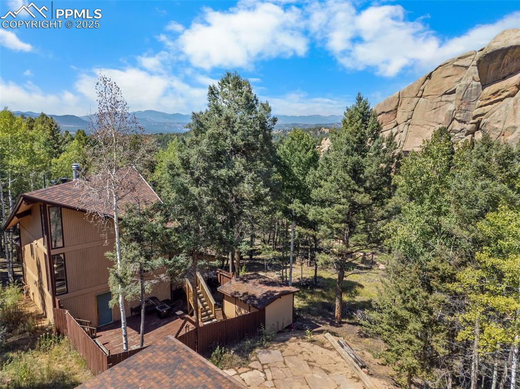 57 Granite Road Florissant, CO 80816 - Photo 5 of 46 a view of a patio with table and chairs and potted plants