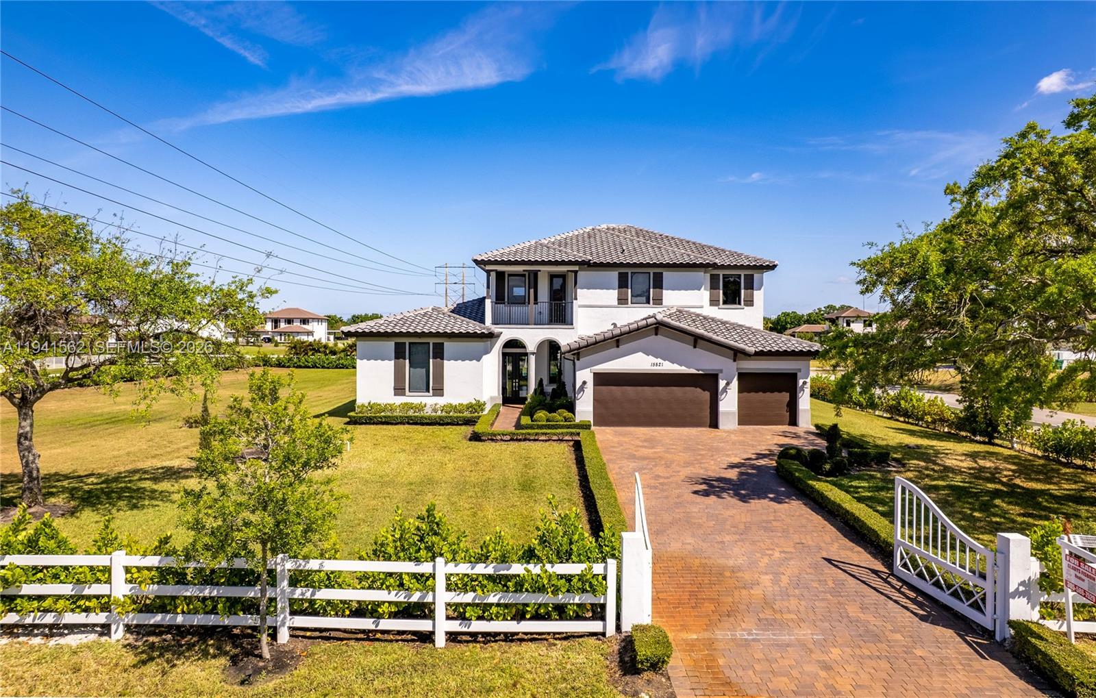 15821 Southwest 49th Street Southwest Ranches, FL 33331 - Photo 1 of 67 a front view of a house with a yard