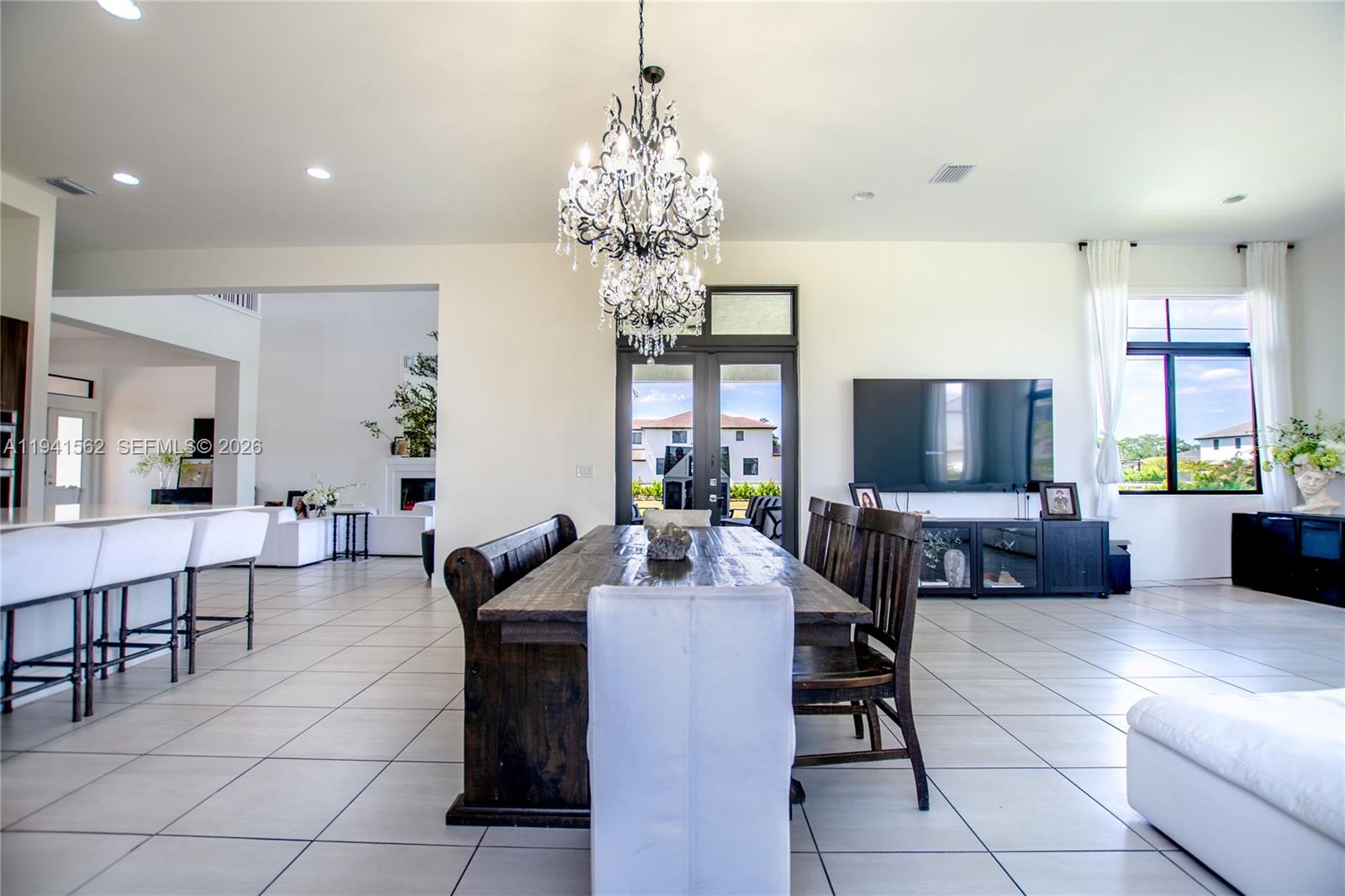 15821 Southwest 49th Street Southwest Ranches, FL 33331 - Photo 15 of 67 a living room with fireplace furniture and a flat screen tv