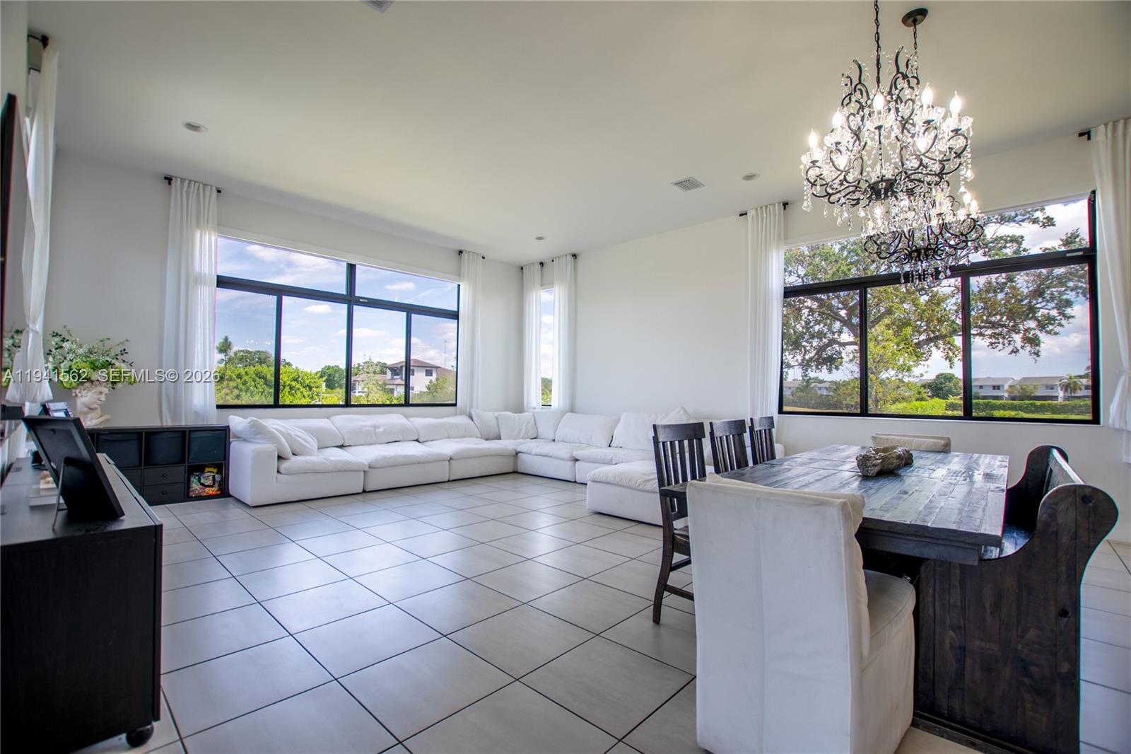 15821 Southwest 49th Street Southwest Ranches, FL 33331 - Photo 17 of 67 a living room with furniture and a large window