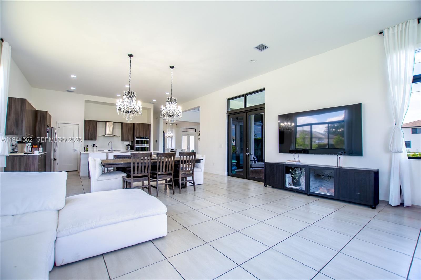 15821 Southwest 49th Street Southwest Ranches, FL 33331 - Photo 18 of 67 a living room with furniture and a flat screen tv