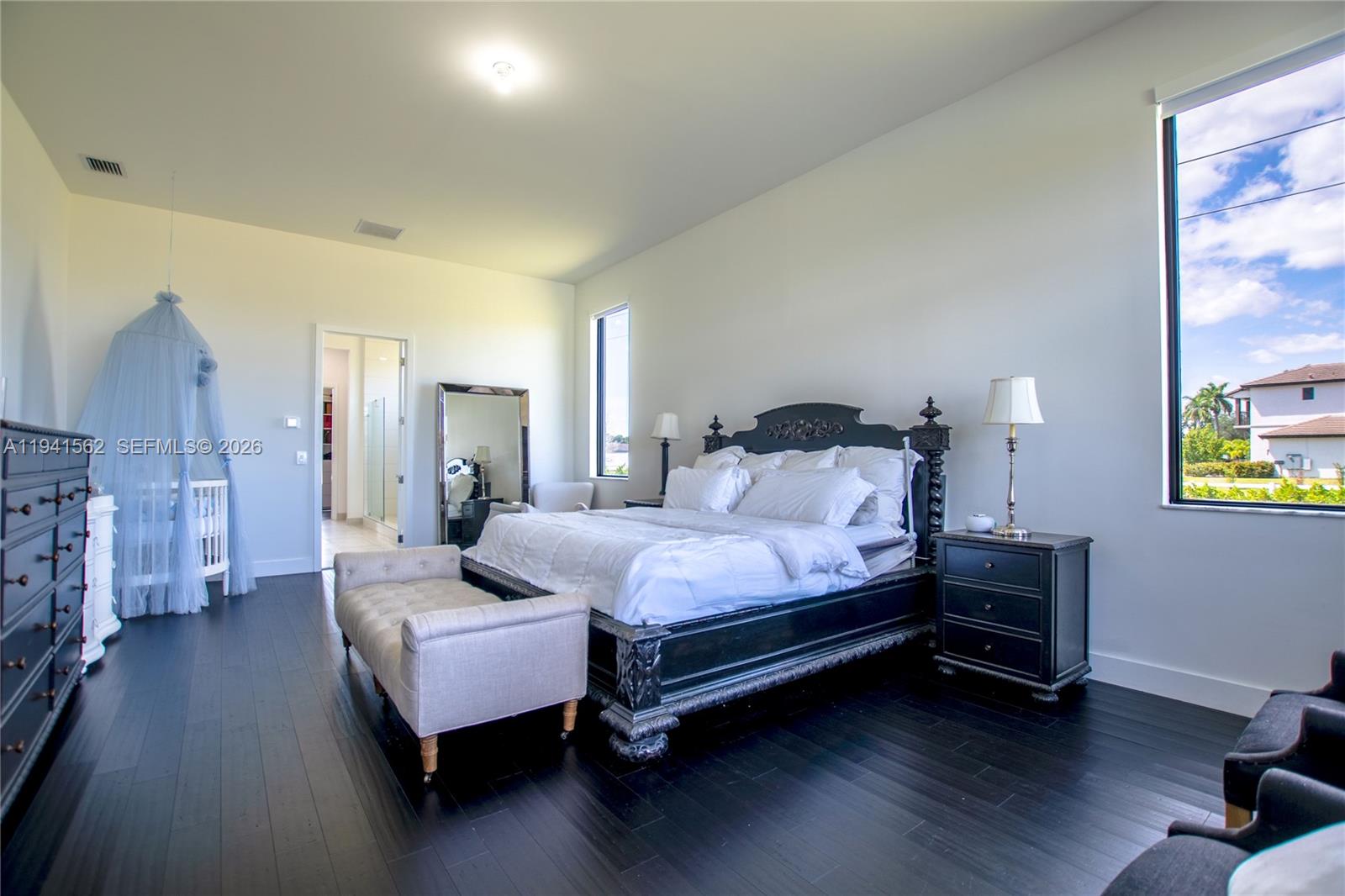 15821 Southwest 49th Street Southwest Ranches, FL 33331 - Photo 28 of 67 a bedroom with bed and wooden floor