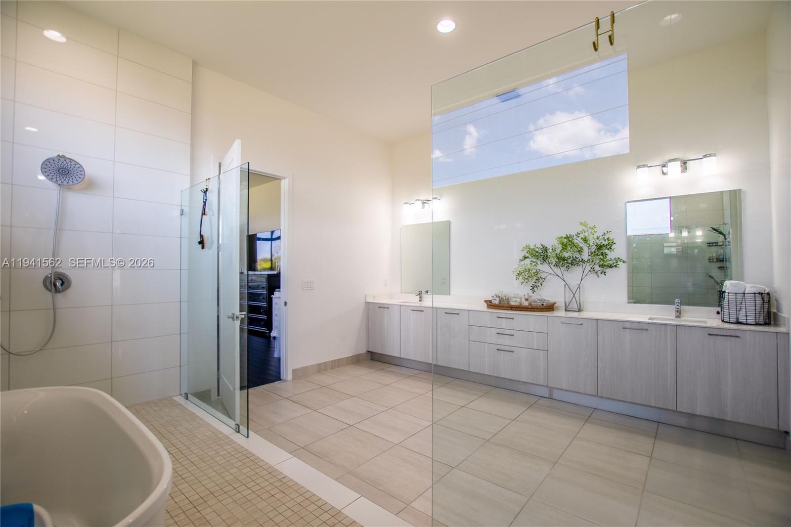 15821 Southwest 49th Street Southwest Ranches, FL 33331 - Photo 34 of 67 a large bathroom with a tub and sink