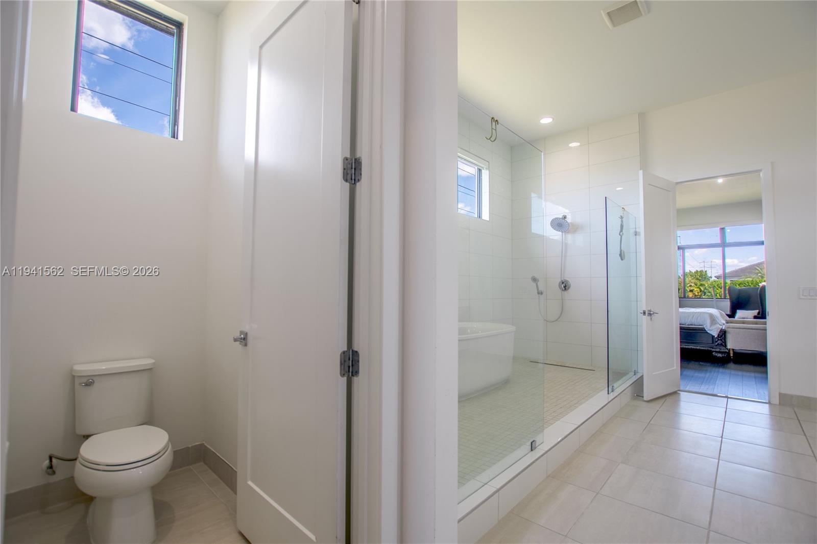 15821 Southwest 49th Street Southwest Ranches, FL 33331 - Photo 35 of 67 a bathroom with a glass door shower