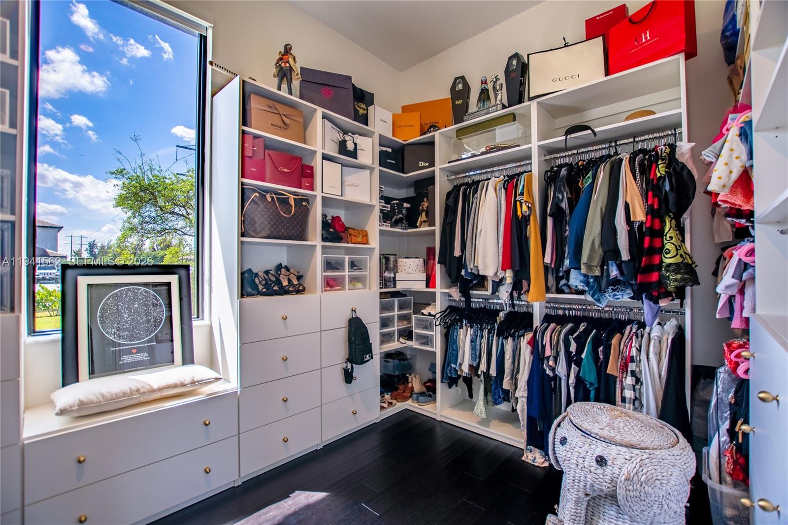 15821 Southwest 49th Street Southwest Ranches, FL 33331 - Photo 37 of 67 a view of walk in closet with clothes and shoes