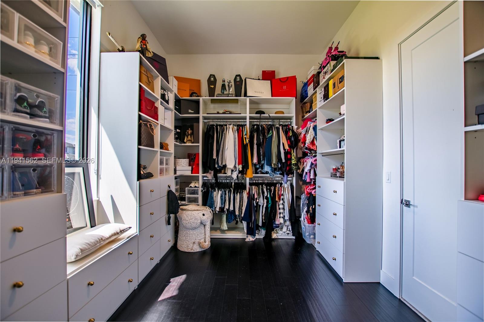 15821 Southwest 49th Street Southwest Ranches, FL 33331 - Photo 38 of 67 a view of walk in closet with clothes and shoes