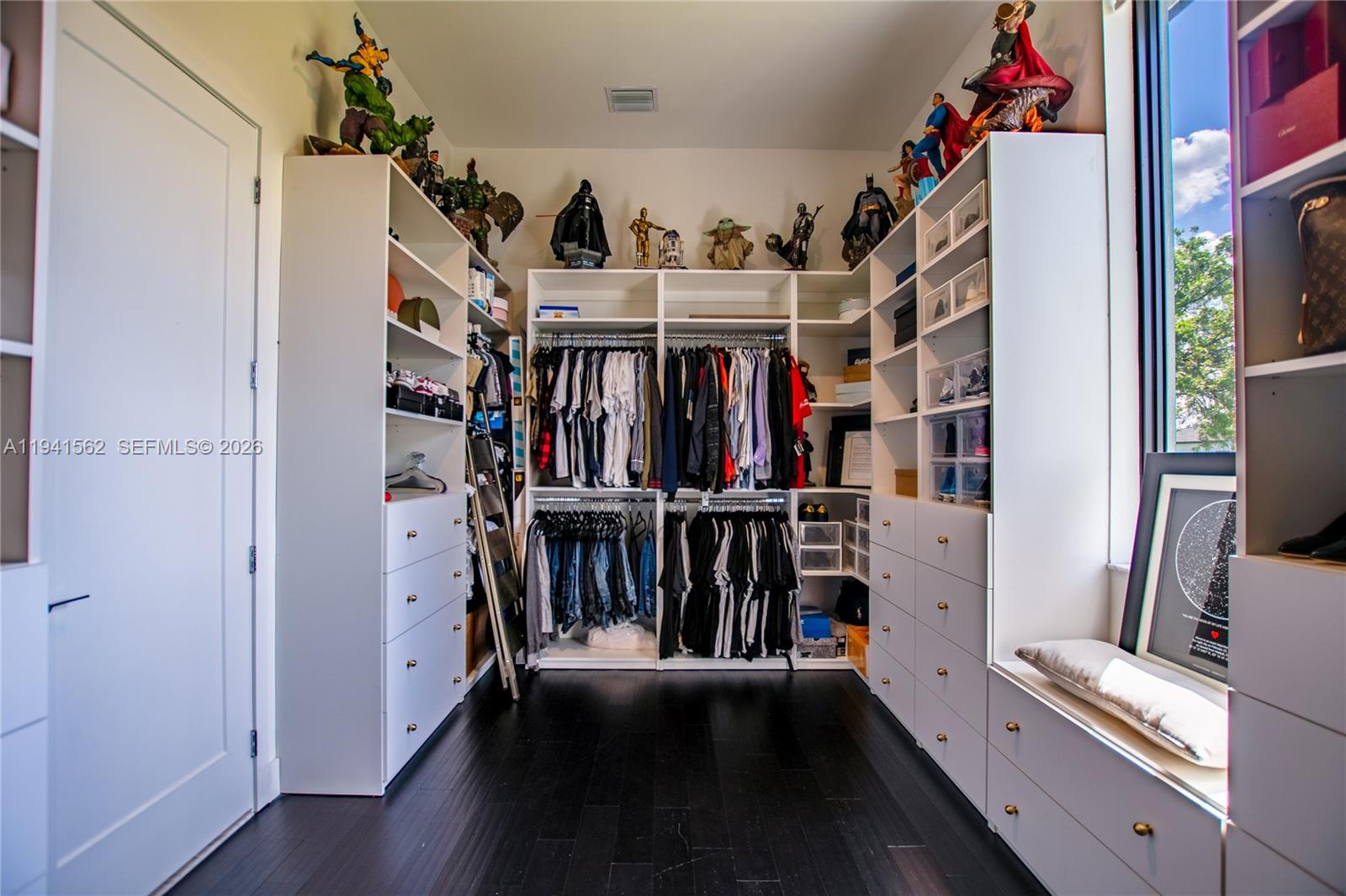 15821 Southwest 49th Street Southwest Ranches, FL 33331 - Photo 39 of 67 a view of walk in closet with clothes and shoes
