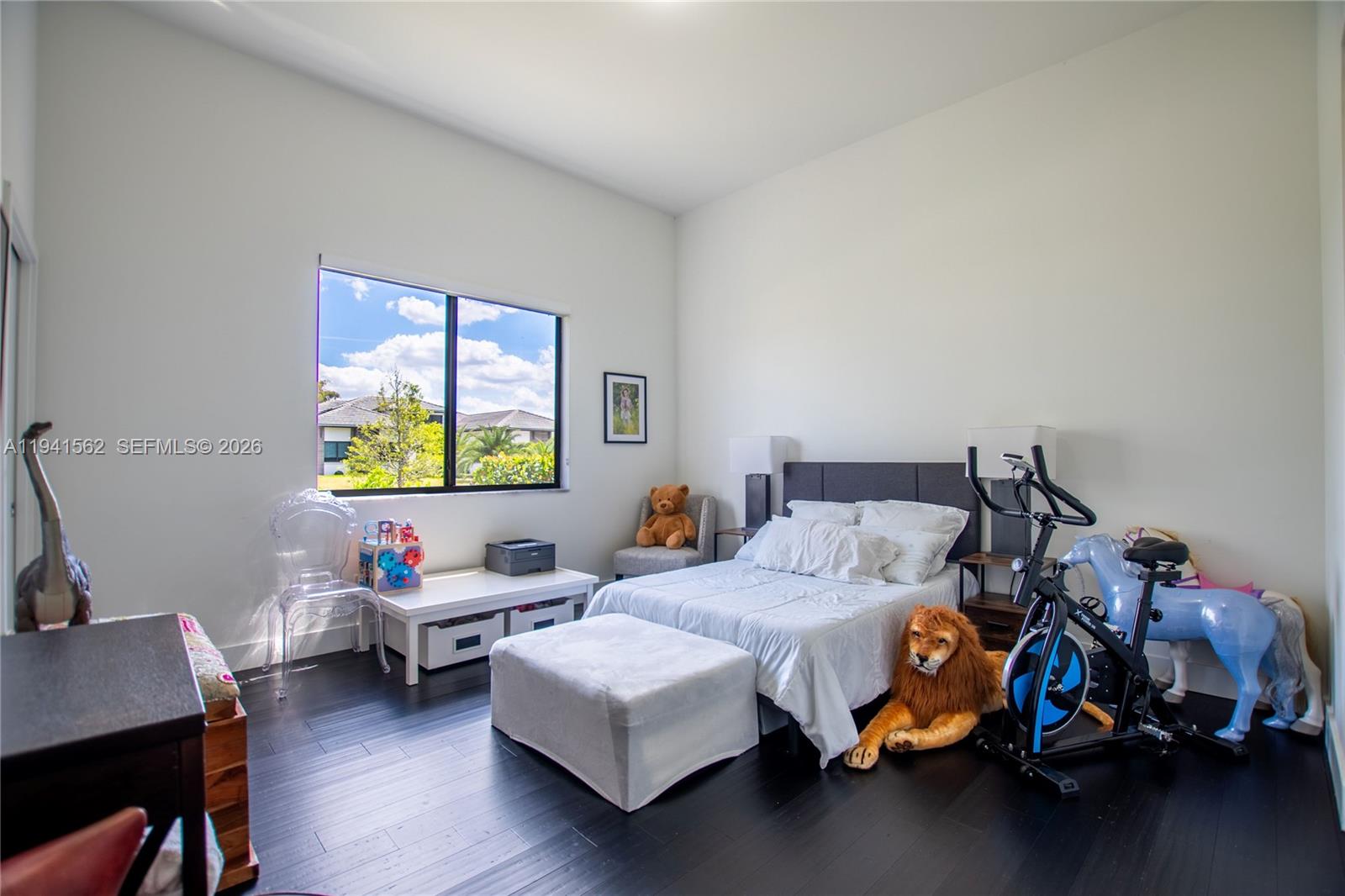 15821 Southwest 49th Street Southwest Ranches, FL 33331 - Photo 40 of 67 a bedroom with furniture and a window