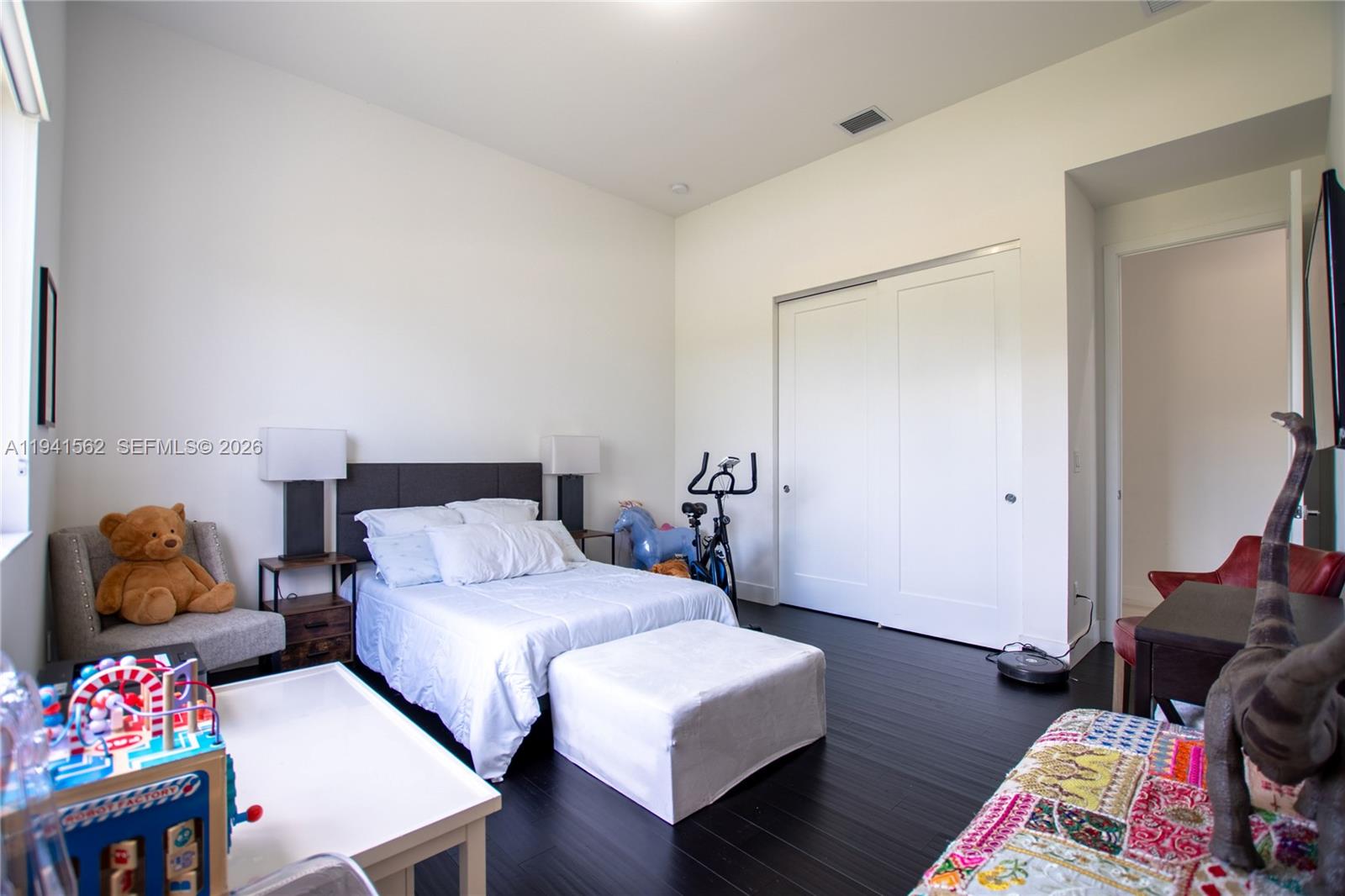 15821 Southwest 49th Street Southwest Ranches, FL 33331 - Photo 41 of 67 a bedroom with bed and a couch