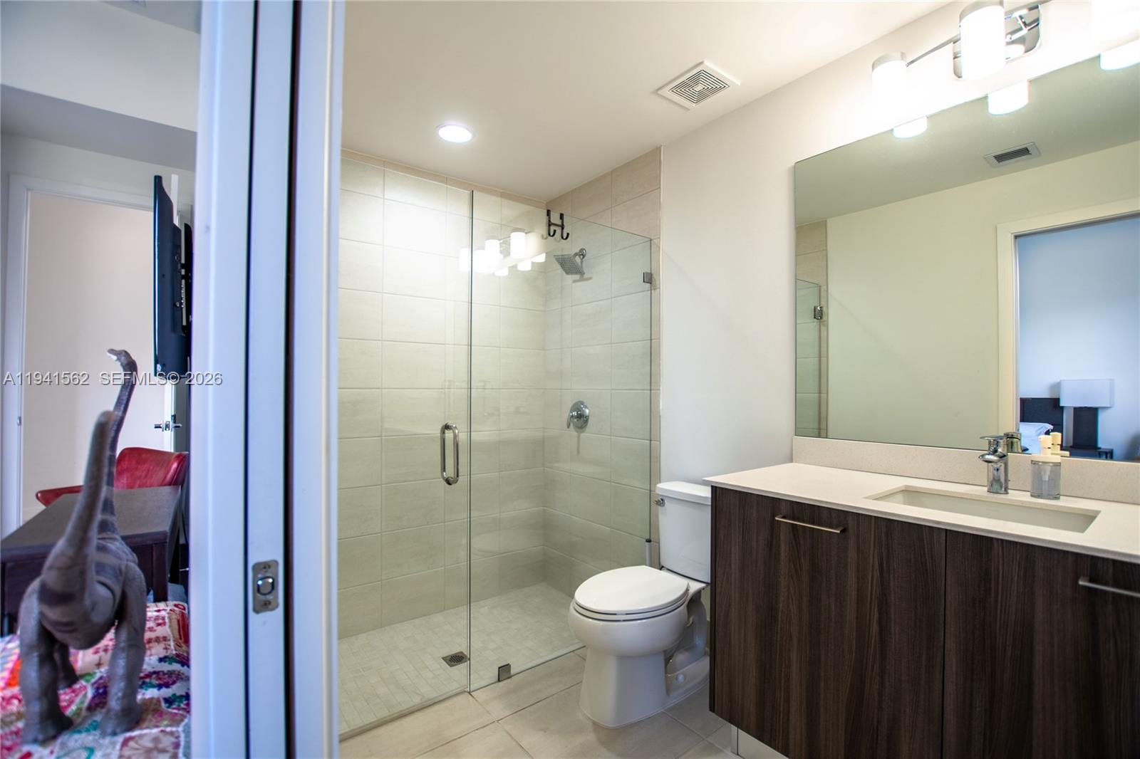 15821 Southwest 49th Street Southwest Ranches, FL 33331 - Photo 42 of 67 a bathroom with a toilet a sink and shower