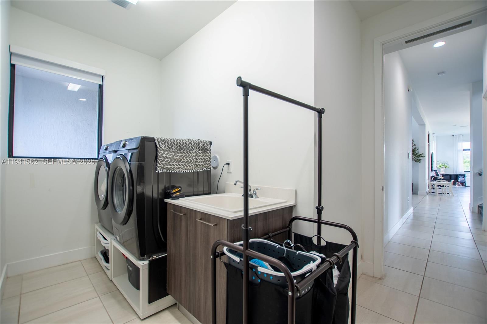 15821 Southwest 49th Street Southwest Ranches, FL 33331 - Photo 43 of 67 a kitchen with stainless steel appliances granite countertop a sink and a refrigerator