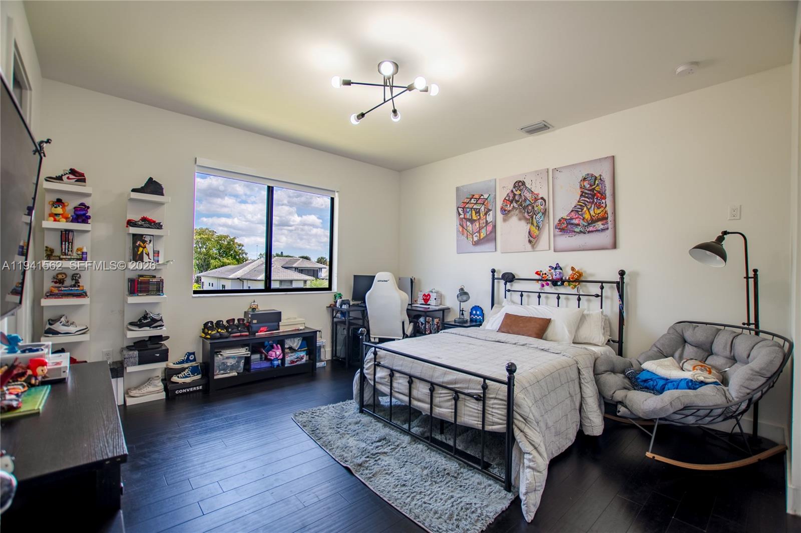 15821 Southwest 49th Street Southwest Ranches, FL 33331 - Photo 46 of 67 a bedroom with a bed a couch and a window