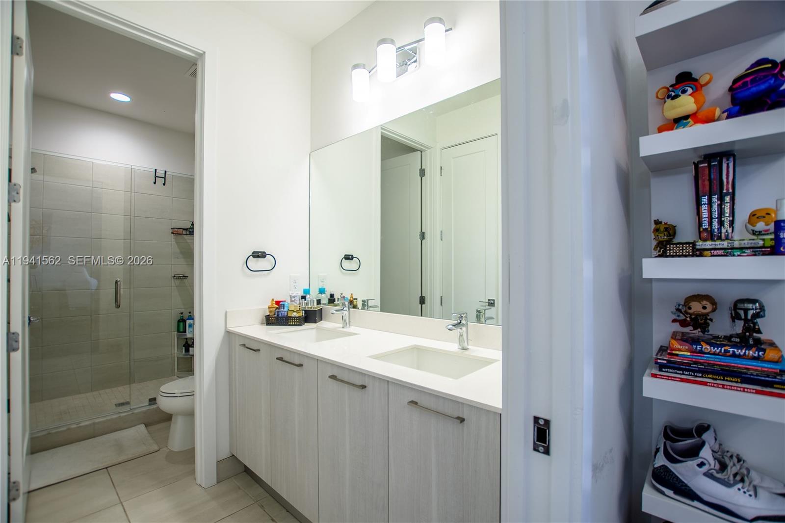 15821 Southwest 49th Street Southwest Ranches, FL 33331 - Photo 47 of 67 a bathroom with a sink a toilet and shower