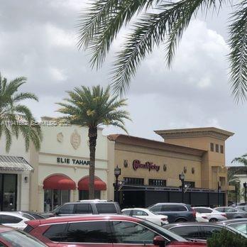 15821 Southwest 49th Street Southwest Ranches, FL 33331 - Photo 64 of 67 a front view of building with yard and outdoor seating