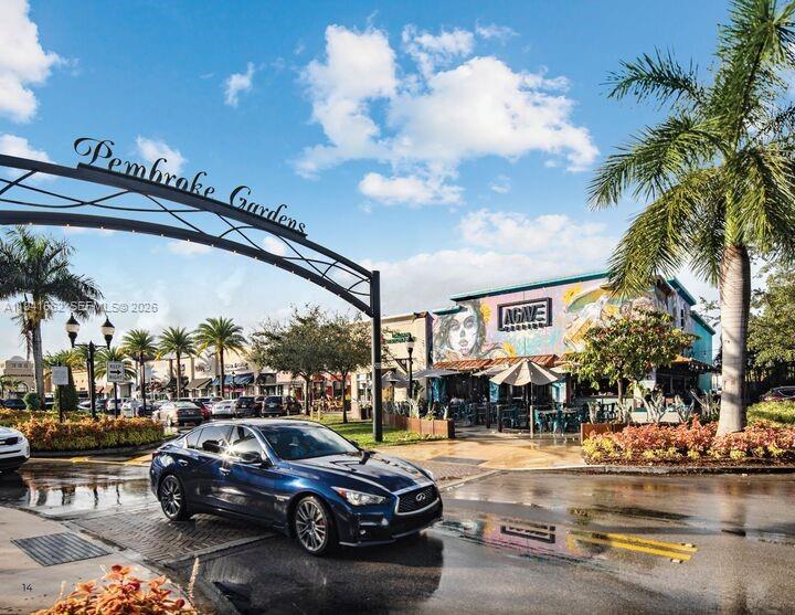 15821 Southwest 49th Street Southwest Ranches, FL 33331 - Photo 65 of 67 a view of a cars park in front of a building