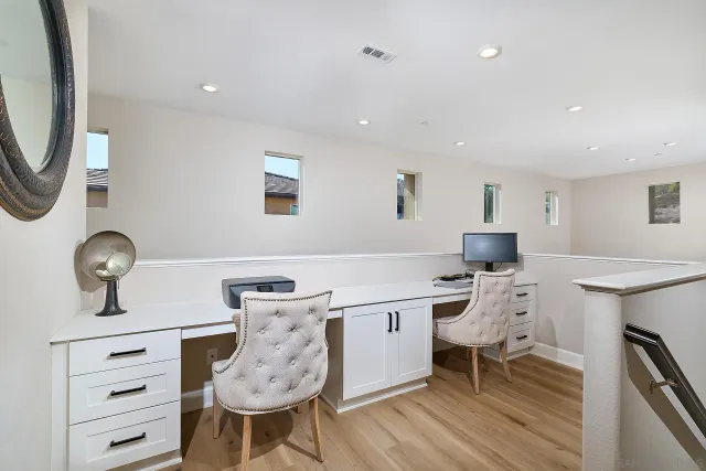 a view of workspace with wooden floor