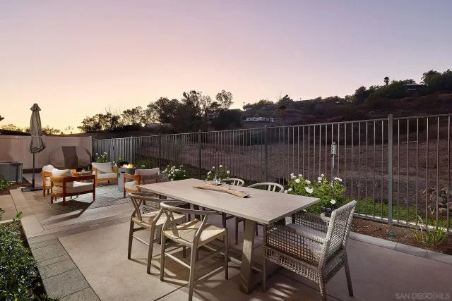 a view of a dinning table and chairs in the roof deck