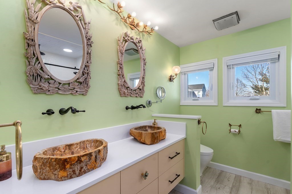 5 Mulberry Lane Canton, MA 02021 - Photo 18 of 36 a bathroom with a sink a mirror and toilet