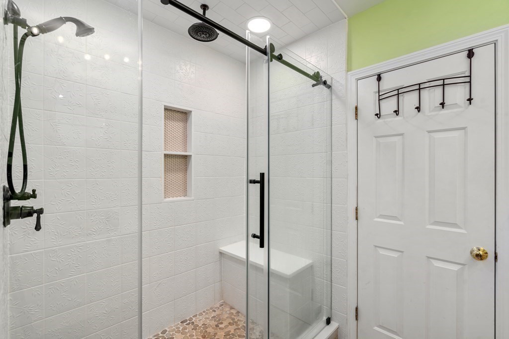 5 Mulberry Lane Canton, MA 02021 - Photo 20 of 36 a bathroom with a glass shower door