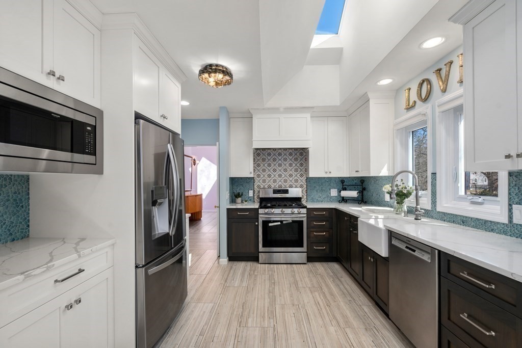 5 Mulberry Lane Canton, MA 02021 - Photo 2 of 36 a kitchen with stainless steel appliances granite countertop a stove cabinets and refrigerator