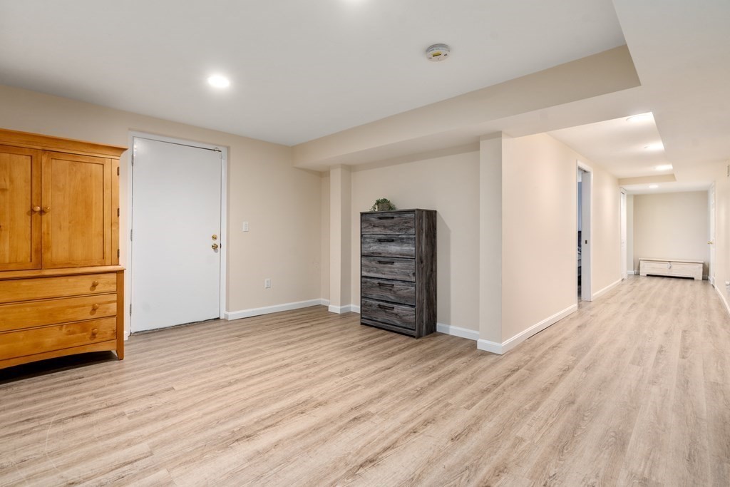 5 Mulberry Lane Canton, MA 02021 - Photo 23 of 36 wooden floor and cabinet in a room