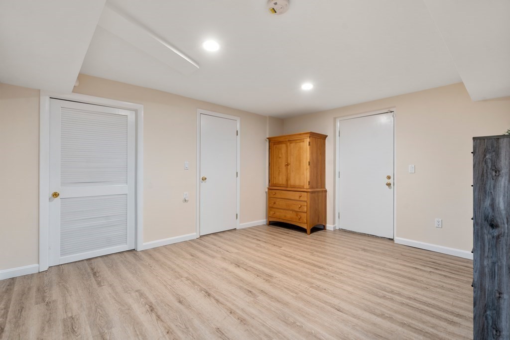 5 Mulberry Lane Canton, MA 02021 - Photo 24 of 36 a view of an empty room with wooden floor and closet area