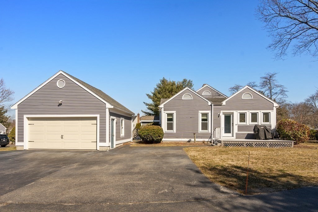 5 Mulberry Lane Canton, MA 02021 - Photo 35 of 36 a front view of a house with a yard