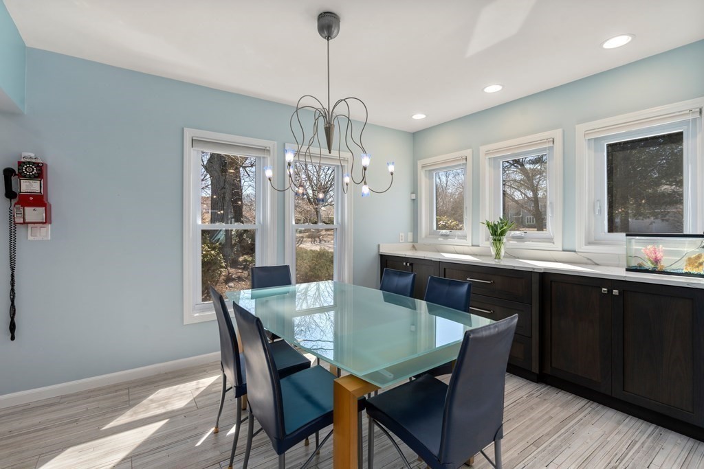 5 Mulberry Lane Canton, MA 02021 - Photo 6 of 36 a view of a dining room with furniture a chandelier and wooden floor