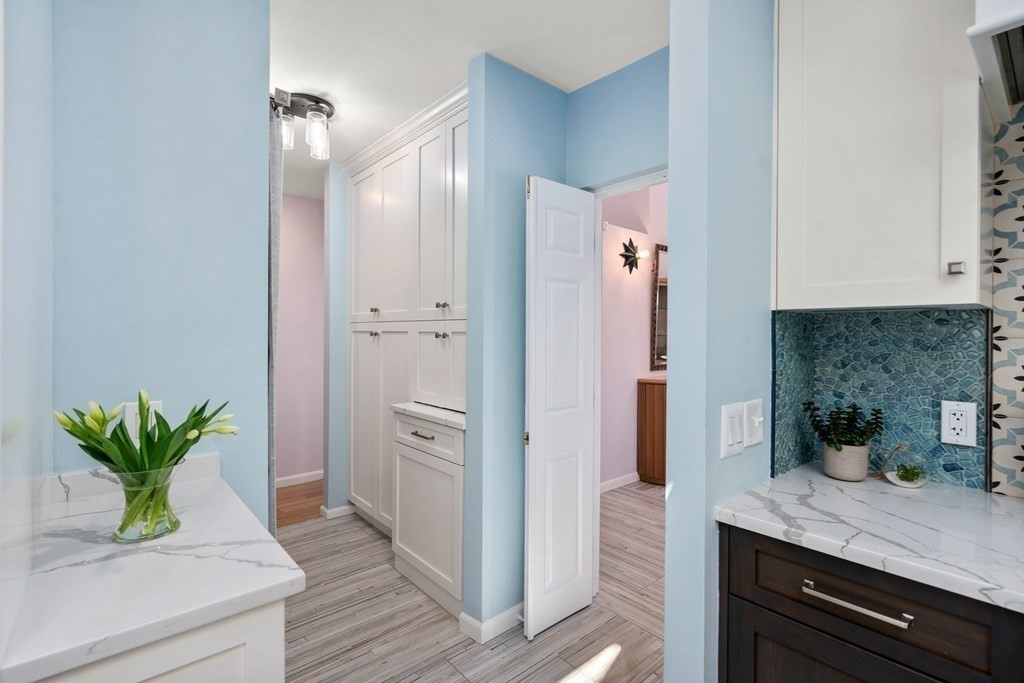 5 Mulberry Lane Canton, MA 02021 - Photo 8 of 36 a kitchen with stainless steel appliances a counter top space and cabinets