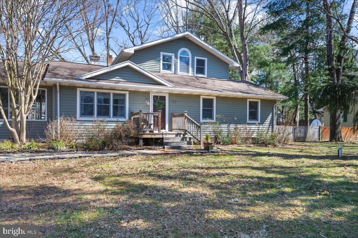 128 Edmore Road Chestertown, MD 21620 - Photo 2 of 59 a front view of a house with a yard patio and outdoor seating