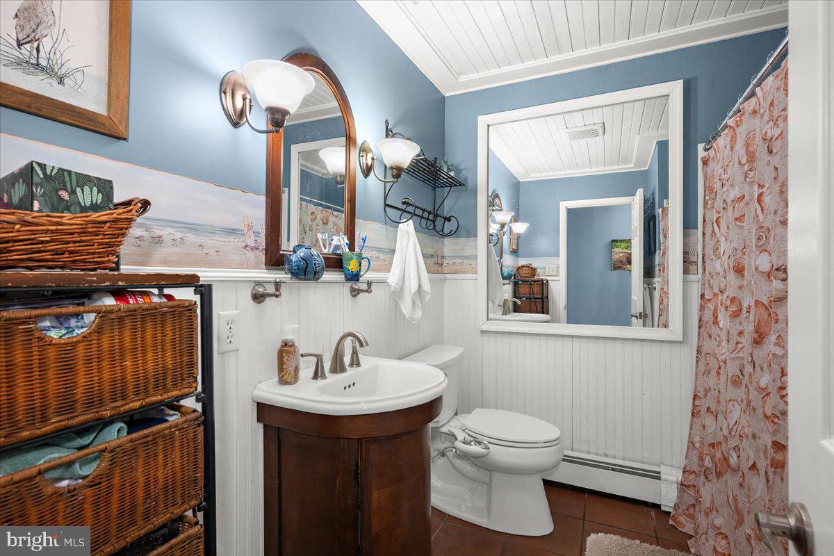 128 Edmore Road Chestertown, MD 21620 - Photo 21 of 59 a bathroom with a sink a toilet and mirror